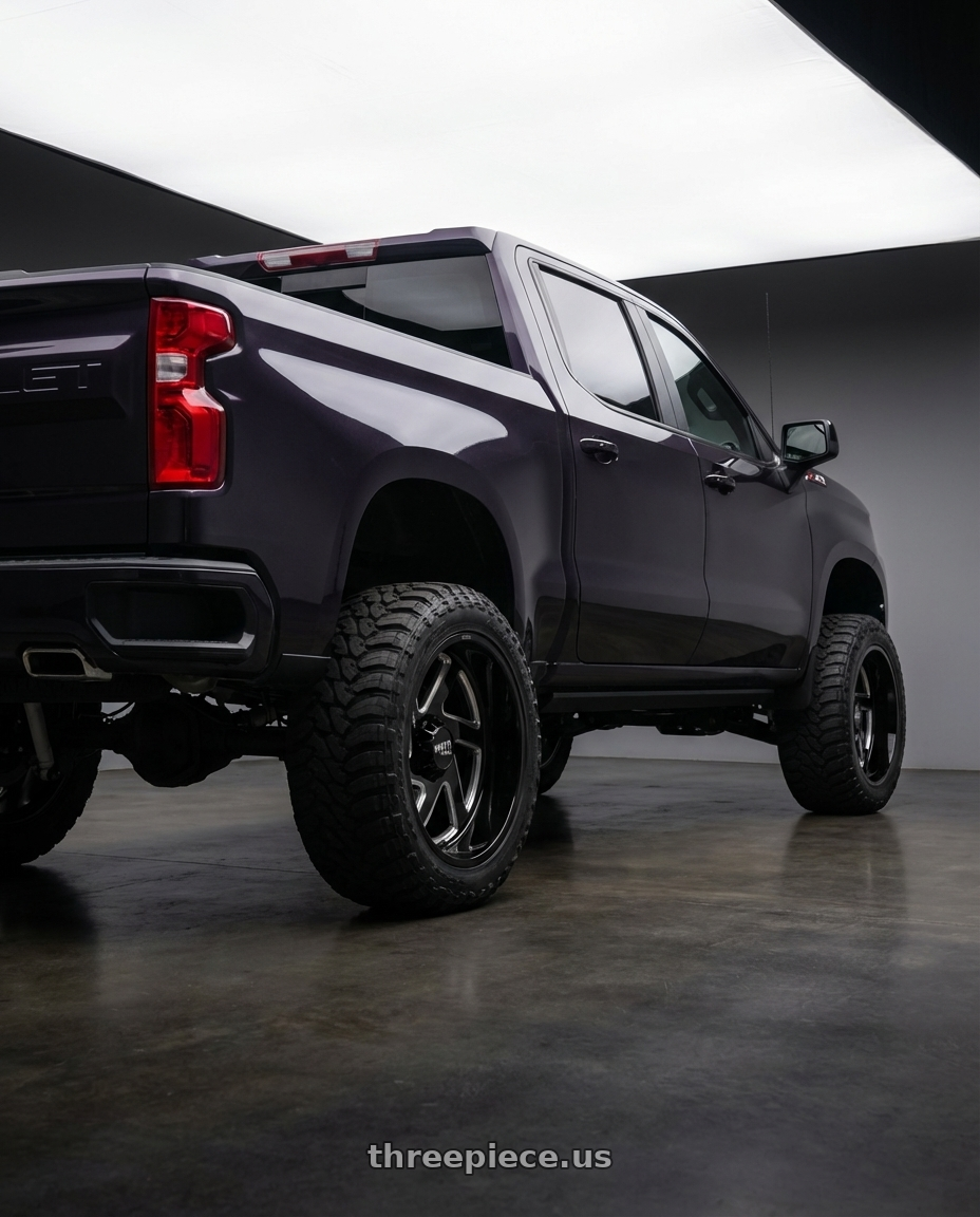 2023 Chevrolet Silverado 1500 with Moto Metal MO400 6X139.7 22X14 -76 GLOSS BLACK MILLED wheels rear three quarter view meaty tires