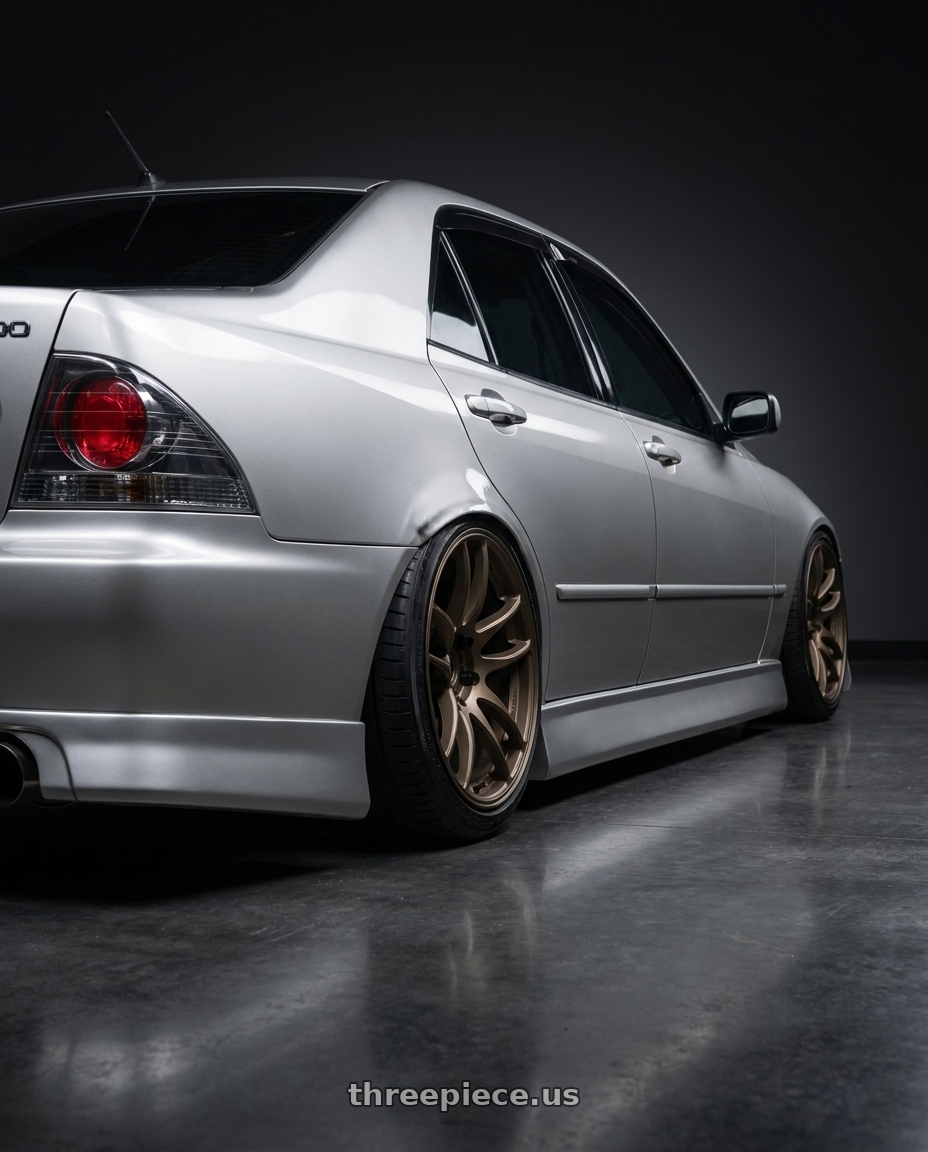 2002 Lexus IS300 with Work Emotion Cr Kiwami 5x114.3 18x9.5 +38 Matte Bronze wheels rear three quarter view slight stretch tires