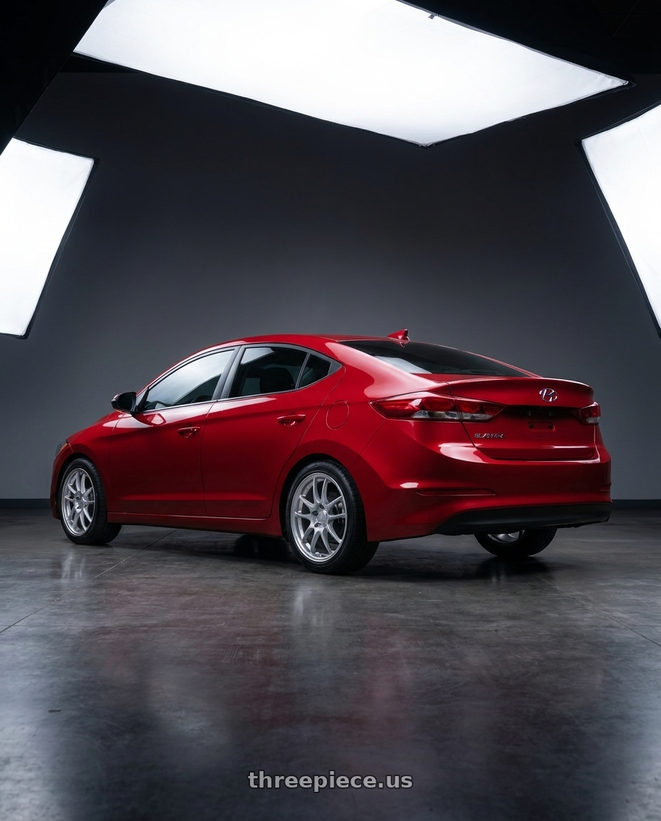 2017 Hyundai Elantra with Enkei PF01 5x114.3 17x8+45 Silver wheels rear three quarter view square tires