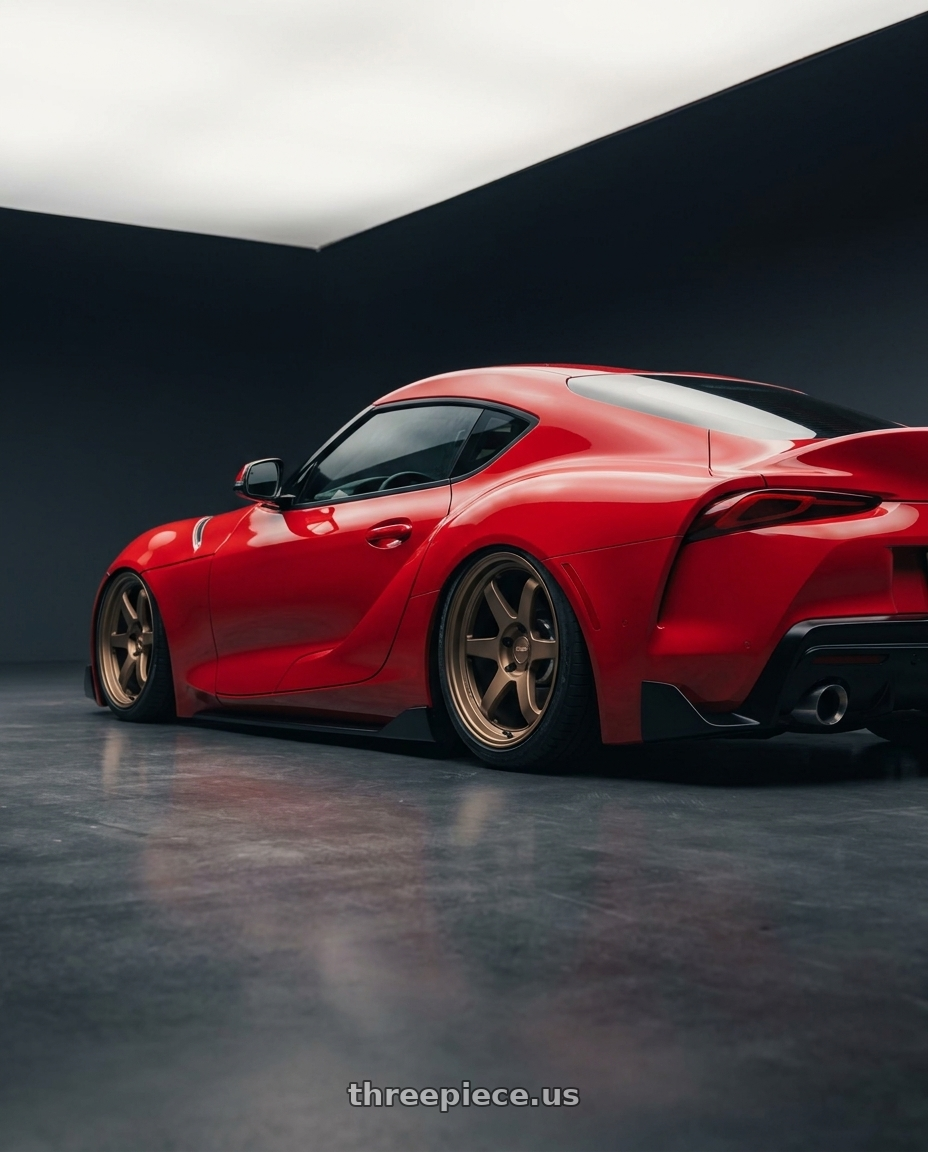 2023 Toyota GR Supra with Kansei K11B Tandem 5X112 19x10.5 22 Bronze wheels rear three quarter view slight stretch tires