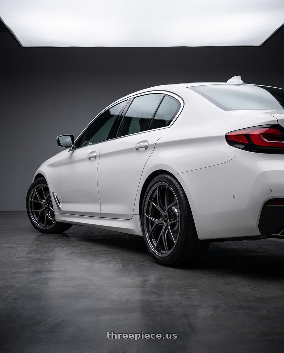 2022 BMW 520i with BBS RI-D 5x108 19x9 +28 Diamond Black wheels rear three quarter view square tires