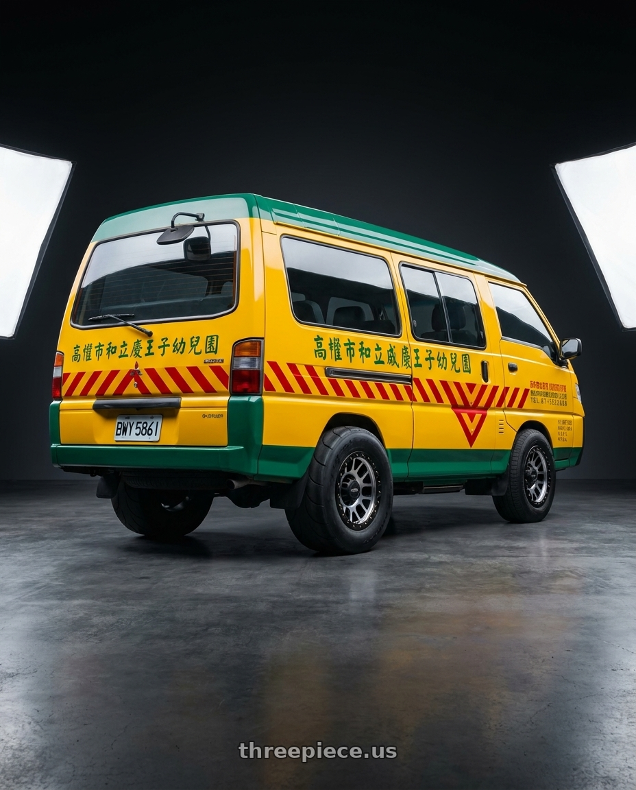 2019 Mitsubishi Delica (台灣幼稚園娃娃車) with Vision Off-Road 111 Nemesis 6x139.7 20x9+10 Matte Black Machined Face wheels rear three quarter view excessive tires