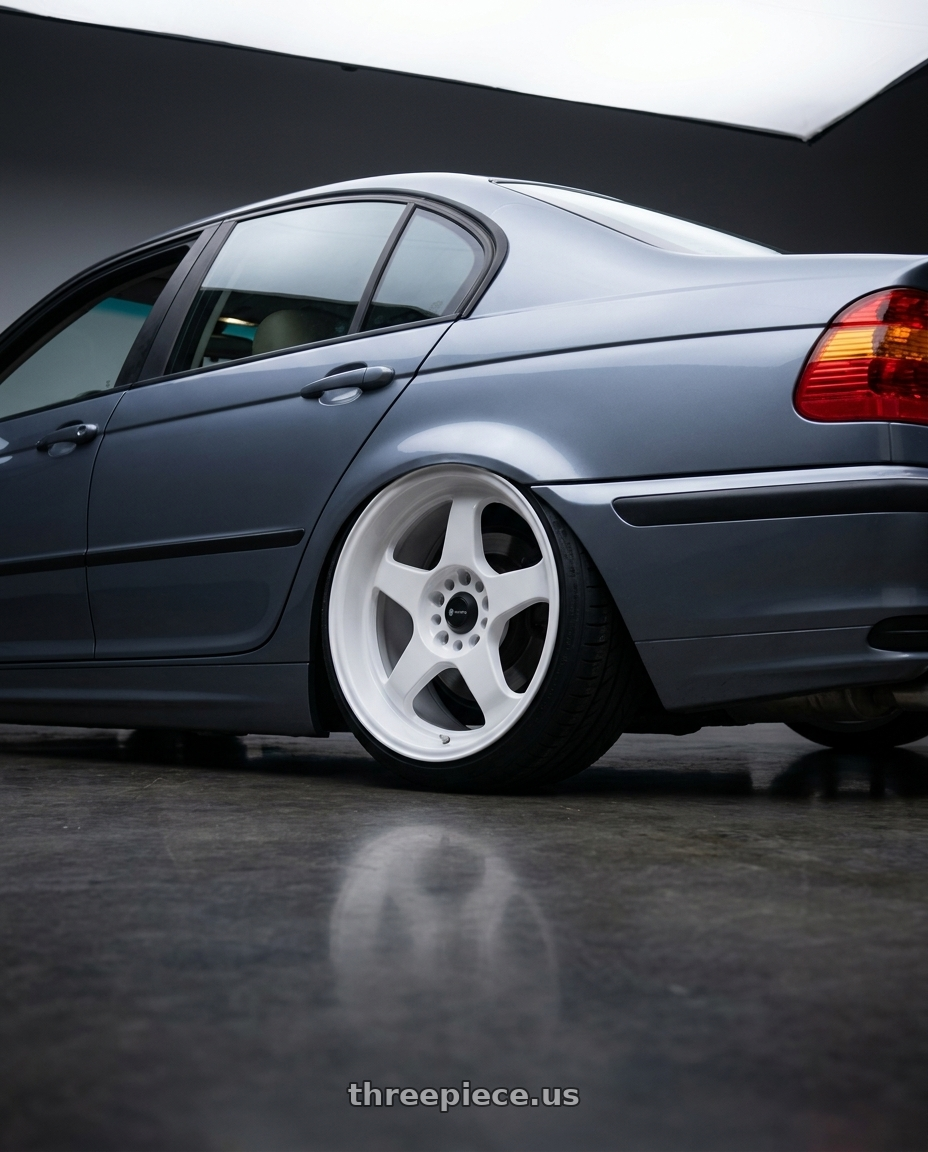 2003 BMW e46 325xi sedan with Vors SP1 5x120 18x8  +35 All White wheels rear three quarter view slight stretch tires
