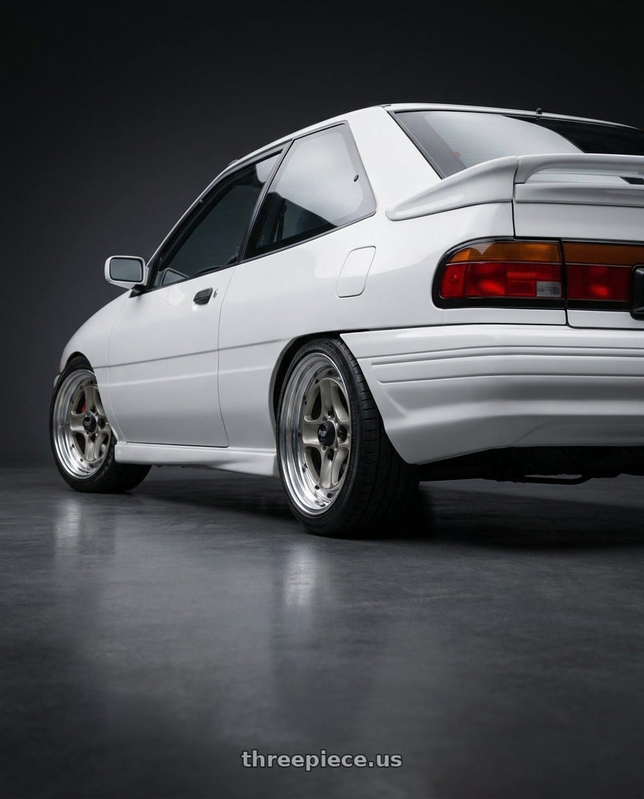 1993 Ford Escort GT with Work Equip 40 4x100 15x7 +22 a disk Brut Silver wheels rear three quarter view square tires