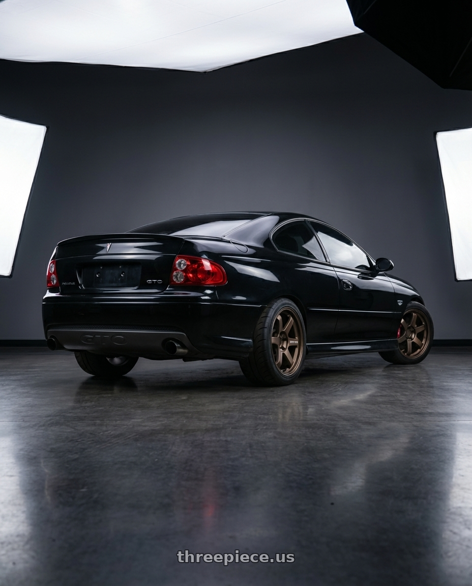 2005 Pontiac GTO with Volk Racing TE37 Ultra M-Spec 5x120 19x9.5+36 wheels rear three quarter view meaty tires