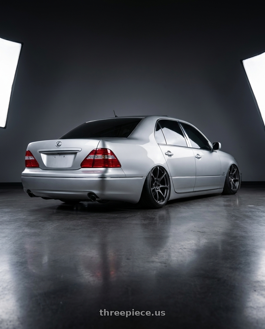 2004 lexus ls430 with Volk Racing NE24 5x114.3 19x9.5 +35 MATTE GUNBLACK wheels rear three quarter view extreme stretch tires