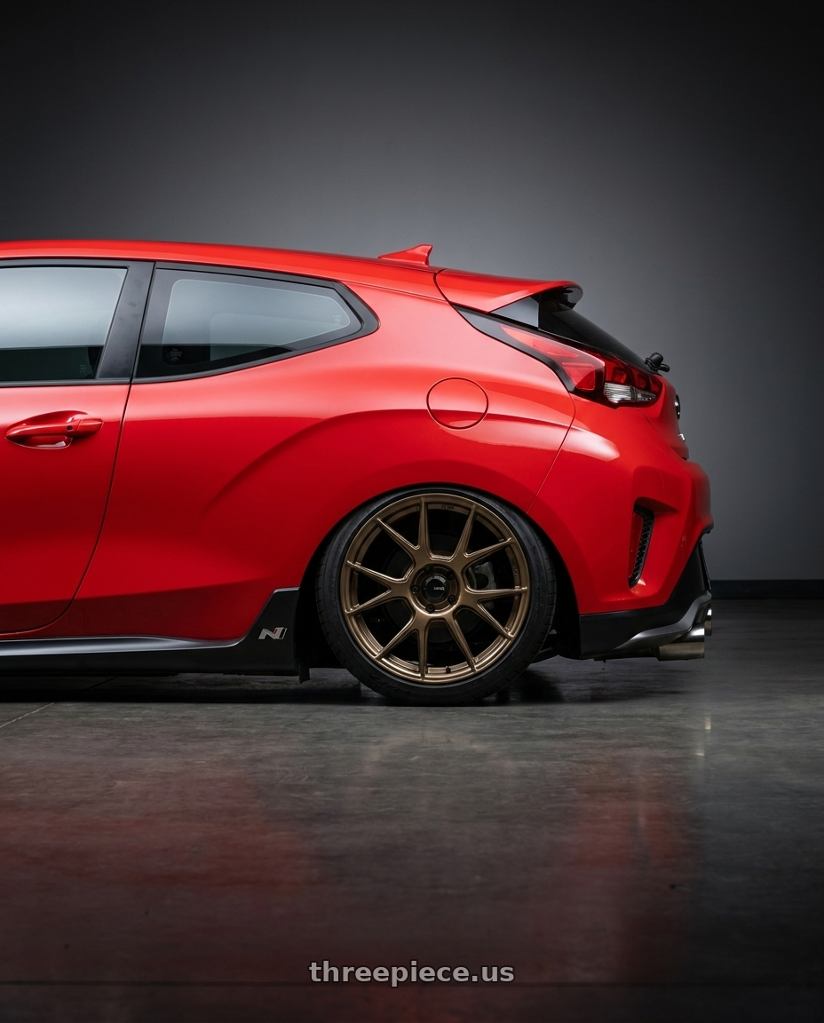 2022 Hyundai Veloster N with Konig Ampliform 5x114.3 19x9.5+35 Gloss Bronze wheels rear three quarter view slight stretch tires
