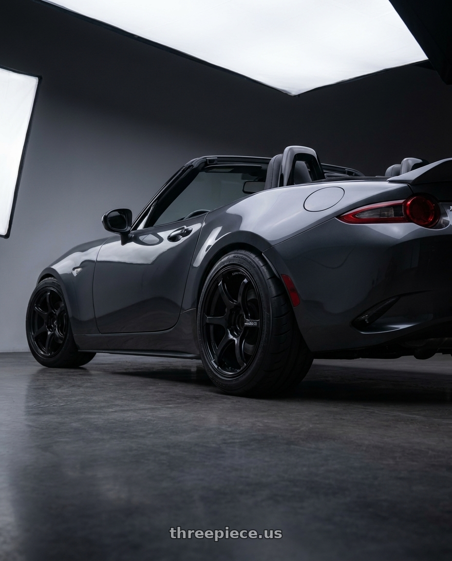 2017 Mazda MX-5 Miata with Advan Racing RG-4 4x100 17x8.0 +35 SEMI GLOSS BLACK wheels rear three quarter view meaty tires