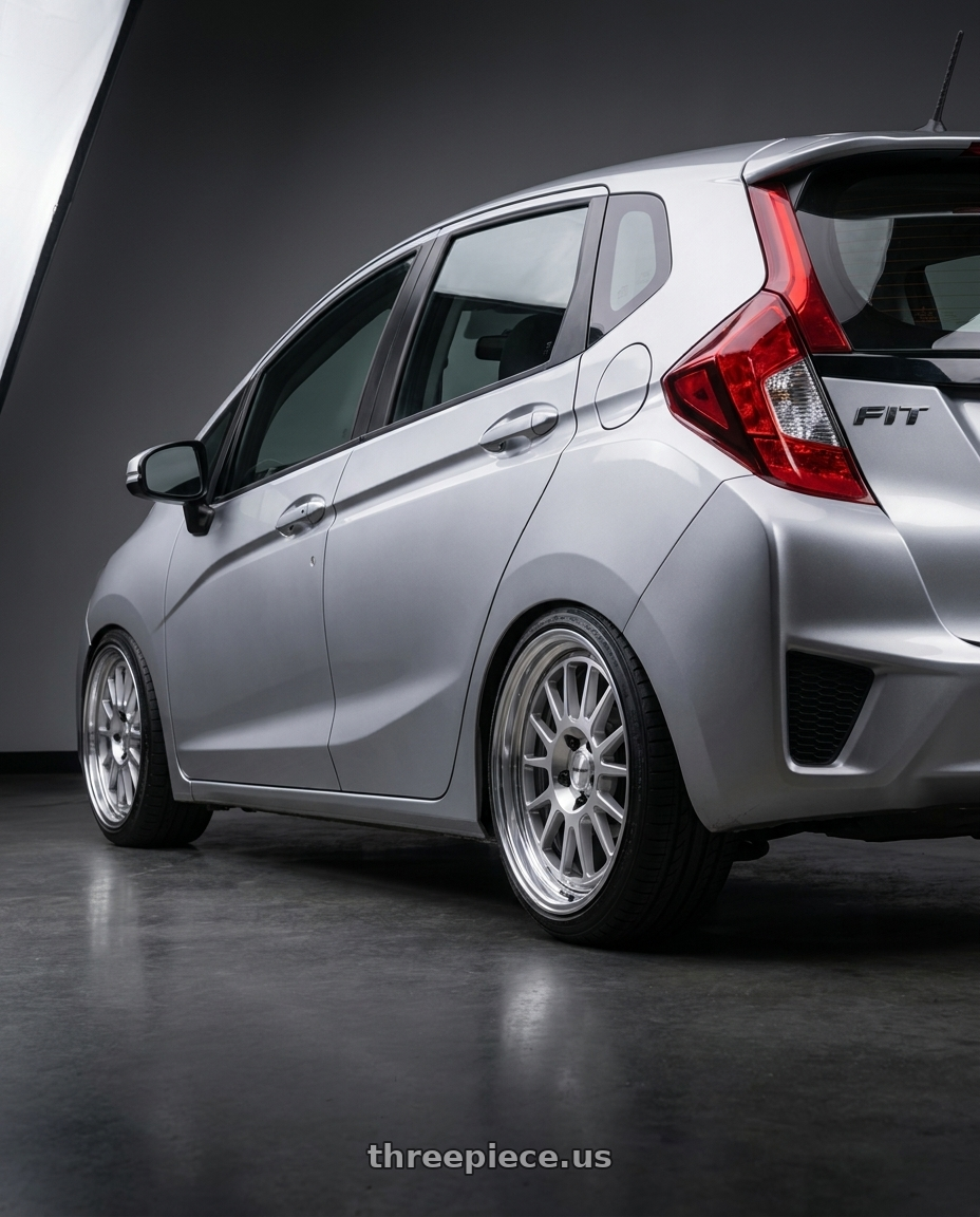 honda fit 2015 with Work Seeker Fx 4x100 16x7+45 L Disk Matte Silver Polish wheels rear three quarter view square tires