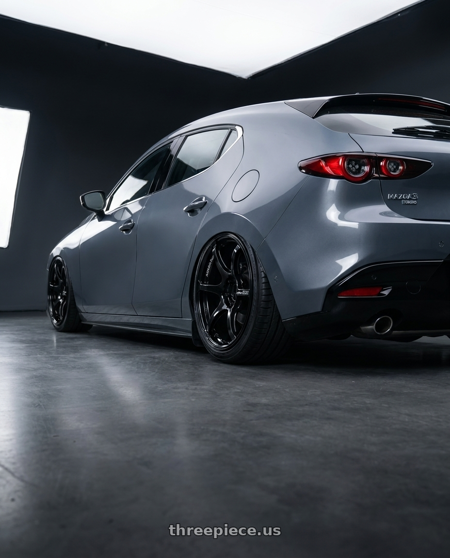 2023 Mazda Mazda3 Turbo with Advan RGIII 5x114.3 18x10.5+25 Gloss Black wheels rear three quarter view slight stretch tires