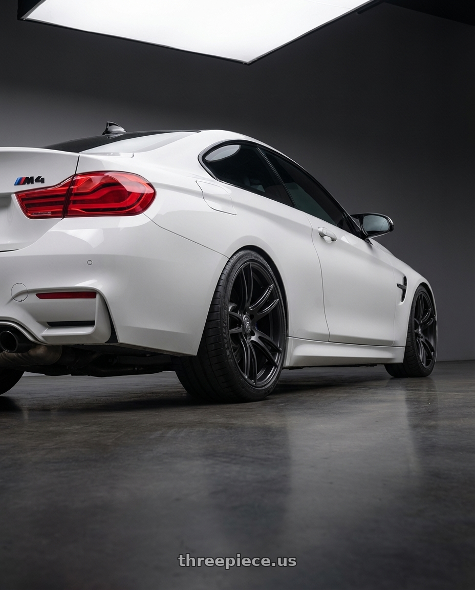 2018 BMW M4 F82 with Forgestar CF5V 5x120 19x9 +38 Satin Black wheels rear three quarter view square tires