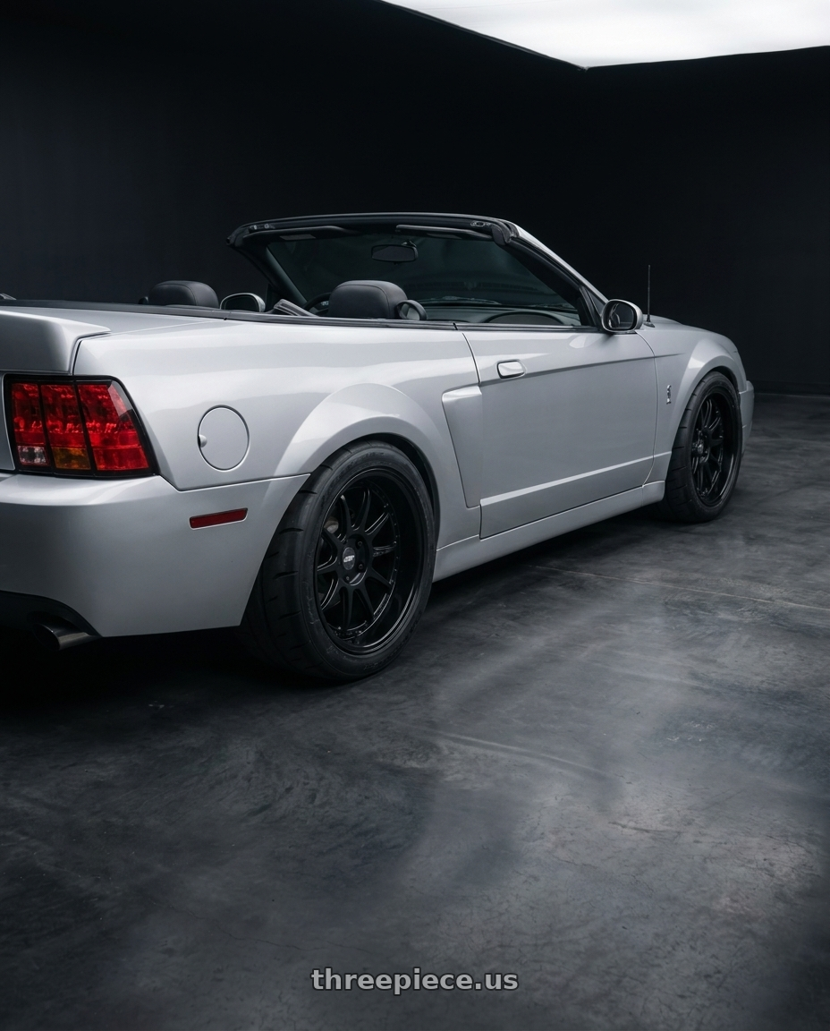 2004 ford mustang  with ESR Wheels CS SERIES CS12 5x114.3 18x9.5 +22 Matte Black wheels rear three quarter view meaty tires
