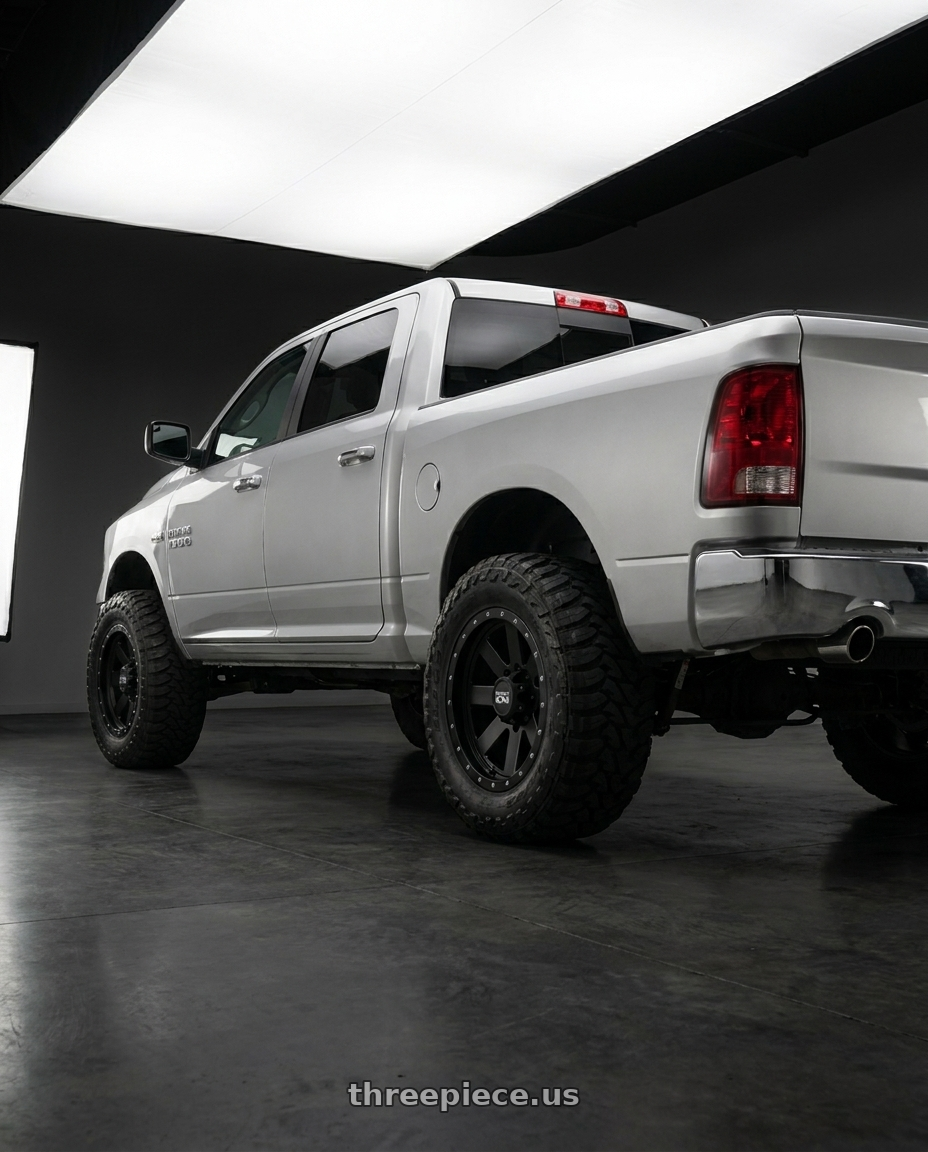 2017 Ram 1500 with Ion Type 134 5x139.7 20x10-19 Matte Black/Black Beadlock wheels rear three quarter view meaty tires
