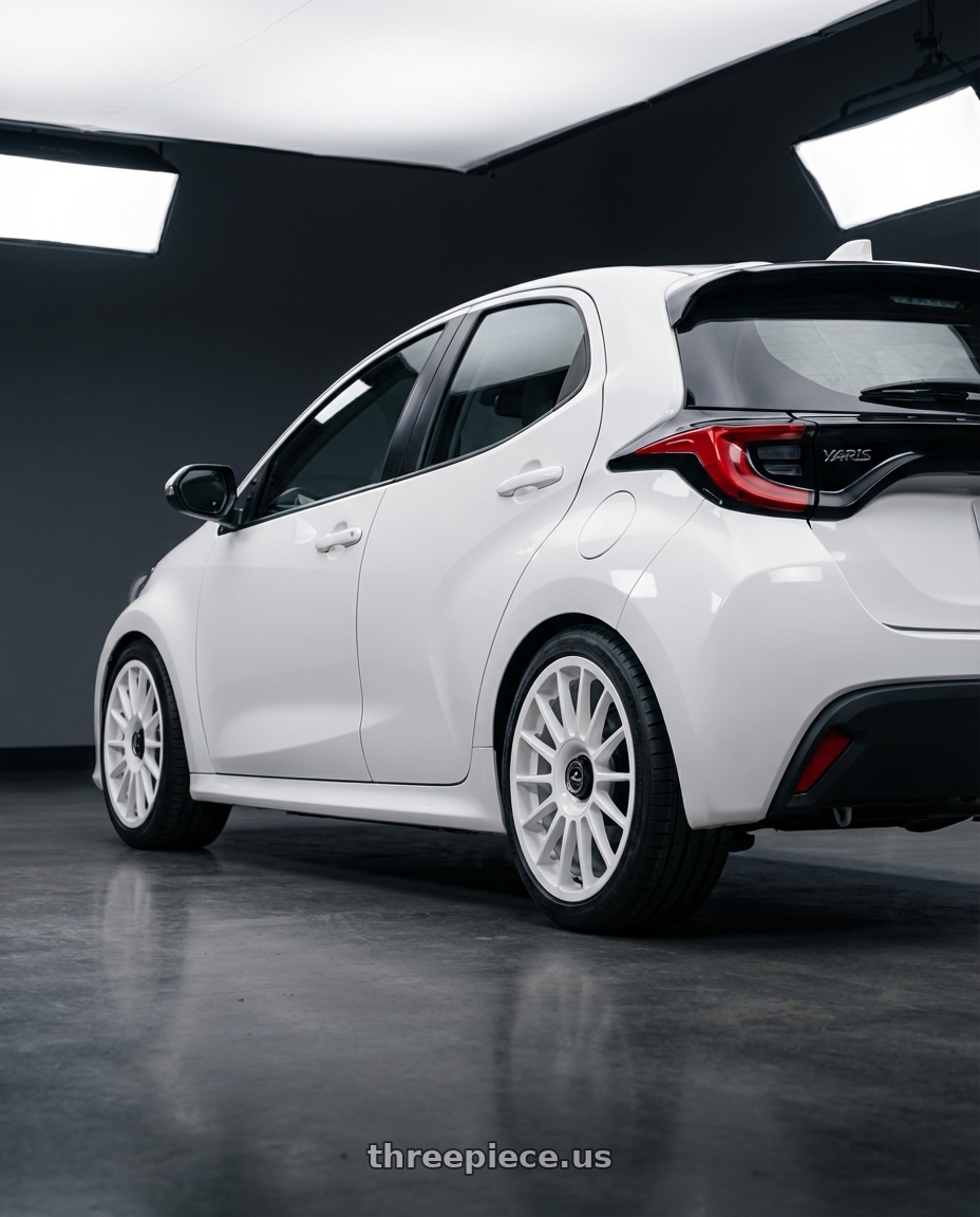 2021 Toyota Yaris  with fifteen52 PODIUM 5x112 / 5x120 18x8.5 +35 RALLY WHITE (GLOSS WHITE) wheels rear three quarter view square tires