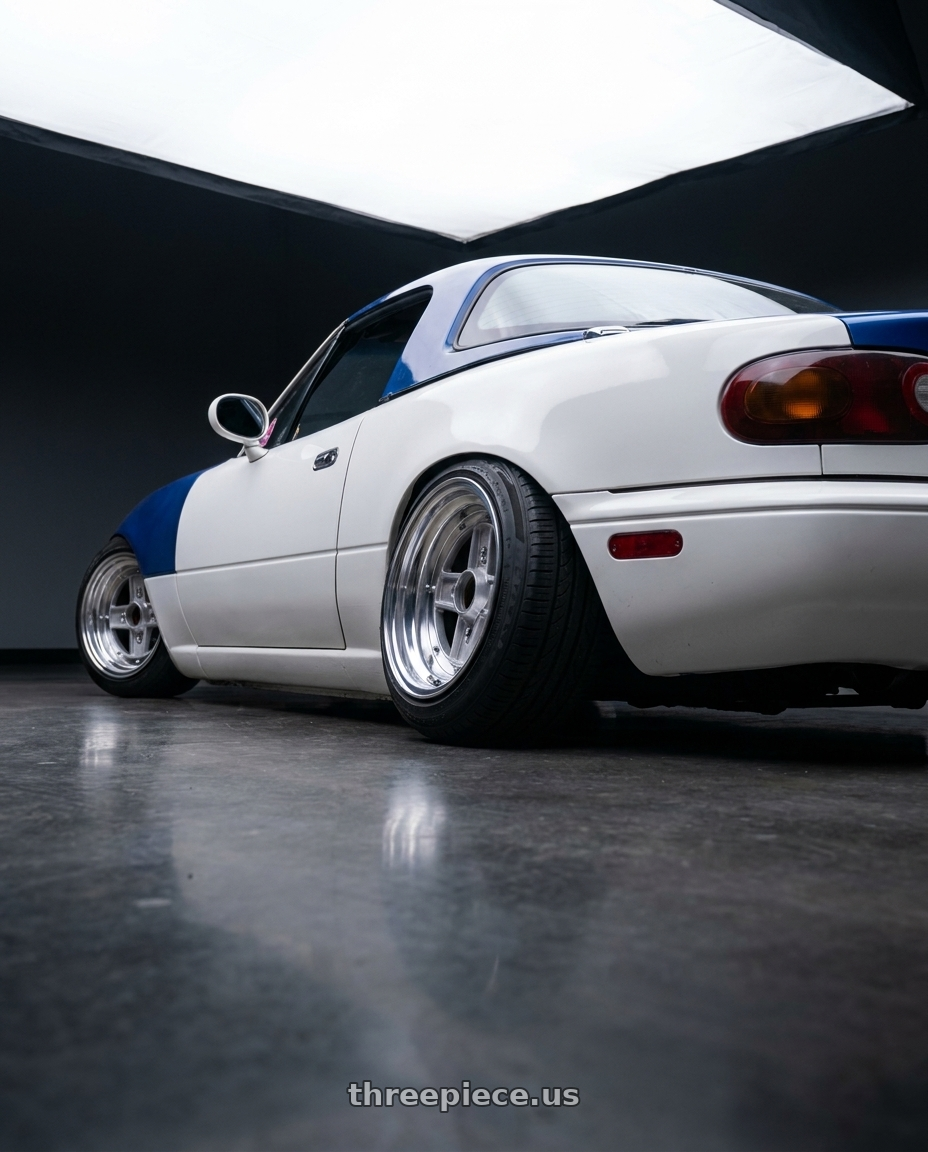 1991 Mazda Miata with Speed Star Mk-II 4x100 14X8.5+-7  Silver wheels rear three quarter view slight stretch tires