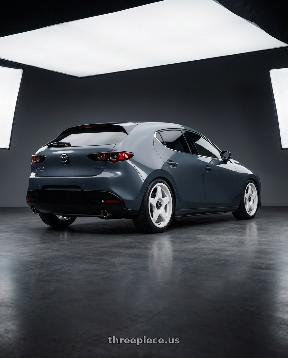 2023 Mazda Mazda3 Turbo with fifteen52 CHICANE 5x114.3 / 5x100 18x8.5 +35 RALLY WHITE (GLOSS WHITE) wheels rear three quarter view square tires