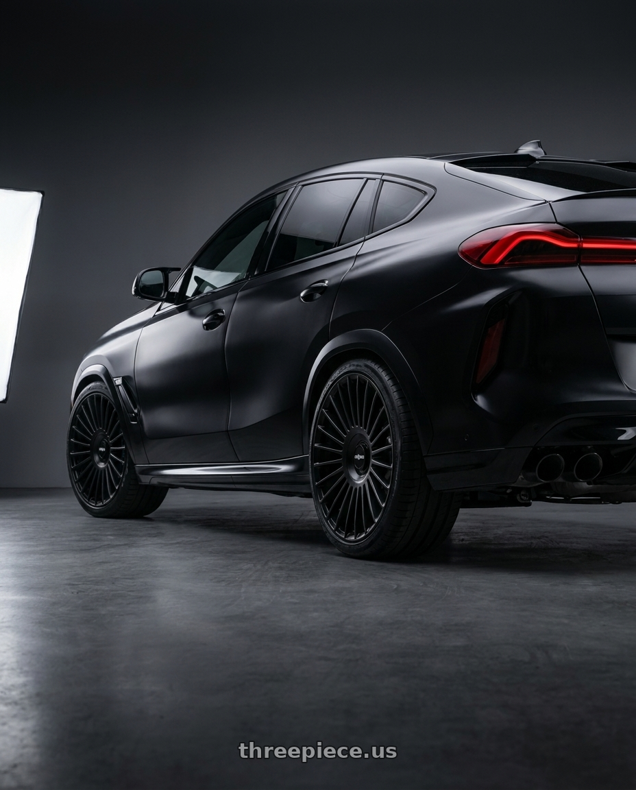 2021 x6 m with Rotiform RC202 GRZ 5X112/5X120 22x10 +35 MATTE BLACK wheels rear three quarter view slight stretch tires