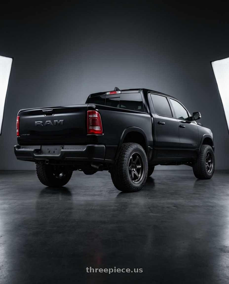 2025 Ram 1500 Lonestar with Volk Racing RAYS 08X 6x139.7 18x8.5-10 Blast Black 2 wheels rear three quarter view meaty tires