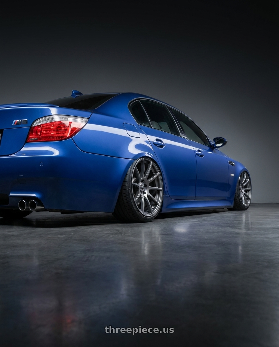 2010 BMW M5 E60 with Forgestar CF10 5x120 20x9 +38 Gloss Anthracite wheels rear three quarter view slight stretch tires