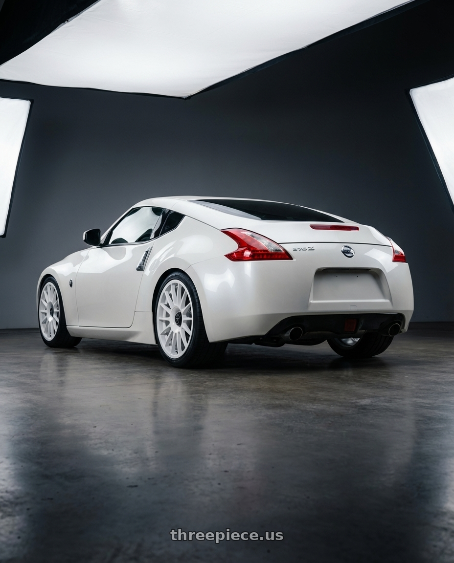 2019 Nissan 370Z with fifteen52 PODIUM 5x114.3 / 5x120 19x8.5 +35 RALLY WHITE (GLOSS WHITE) wheels rear three quarter view square tires