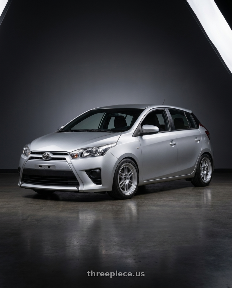 2015 Toyota Yaris with Enkei RPF1 4x100 15x8+28 Silver wheels
