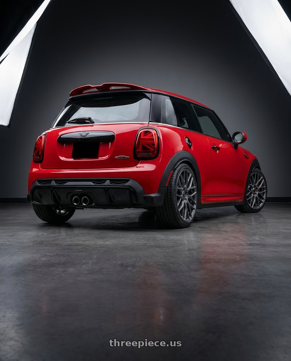 2025 mini jcw red with TOUREN TR76 3276 5x112 20x8.5 +35 GLOSS GRAPHITE wheels rear three quarter view square tires
