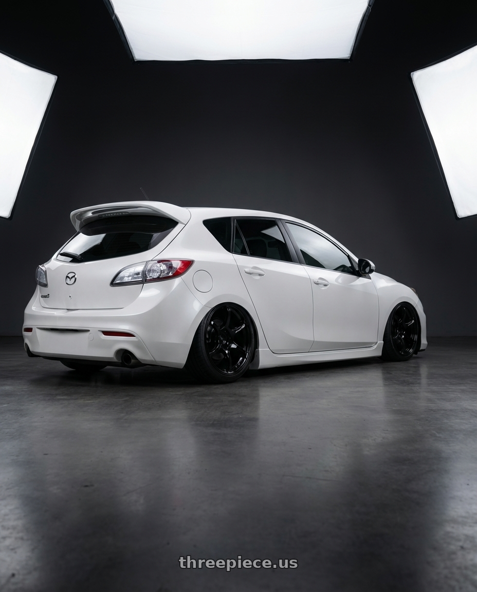 2012 Mazda Mazdaspeed3 with Advan RGIII 5x114.3 18x8.0+37 Gloss Black wheels rear three quarter view slight stretch tires