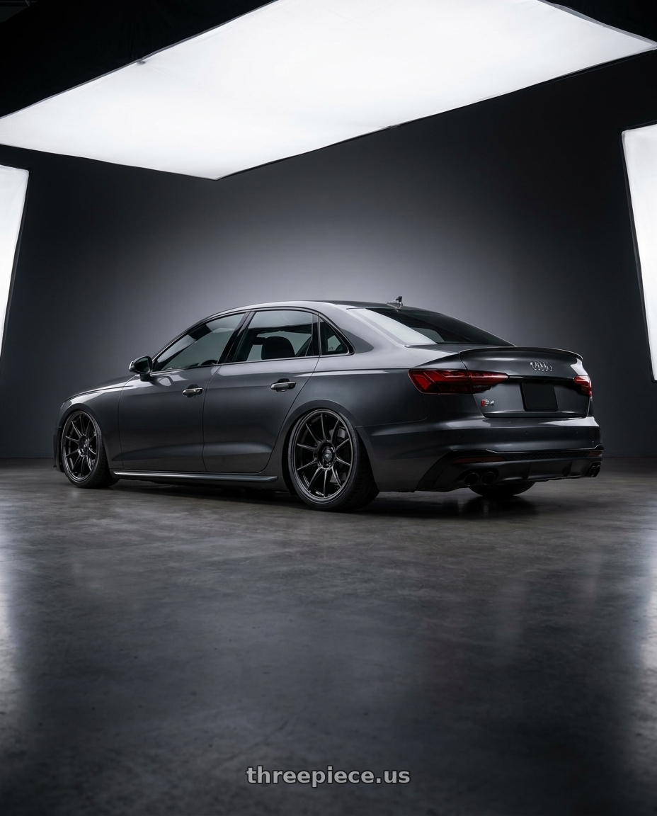 2023 Audi S4 B9 with Konig Oversteer 5x112 20x8.5+42 Gloss Black wheels rear three quarter view slight stretch tires