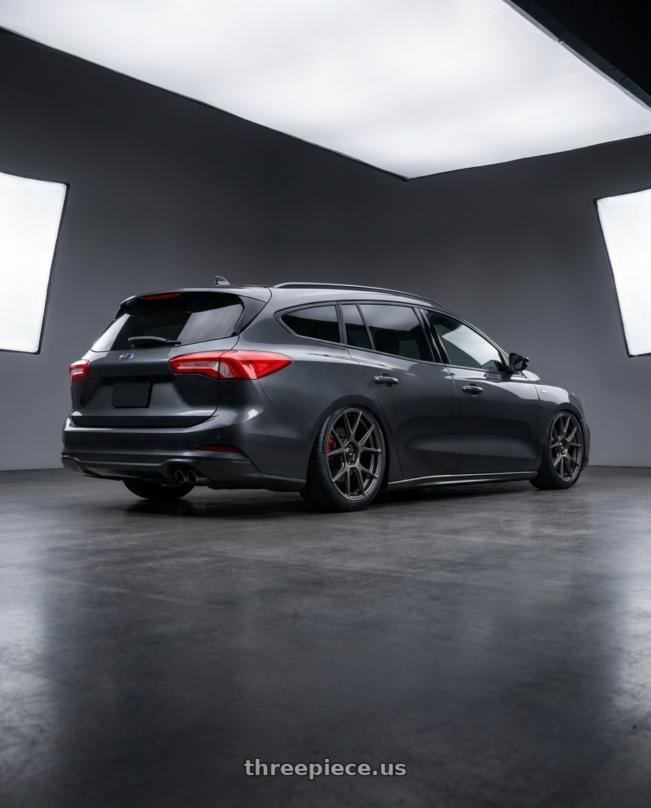 2025  Focus ST-Line wagon  with Konig Ampliform 5x120 20x8.5+45 Dark Metallic Graphite wheels rear three quarter view square tires