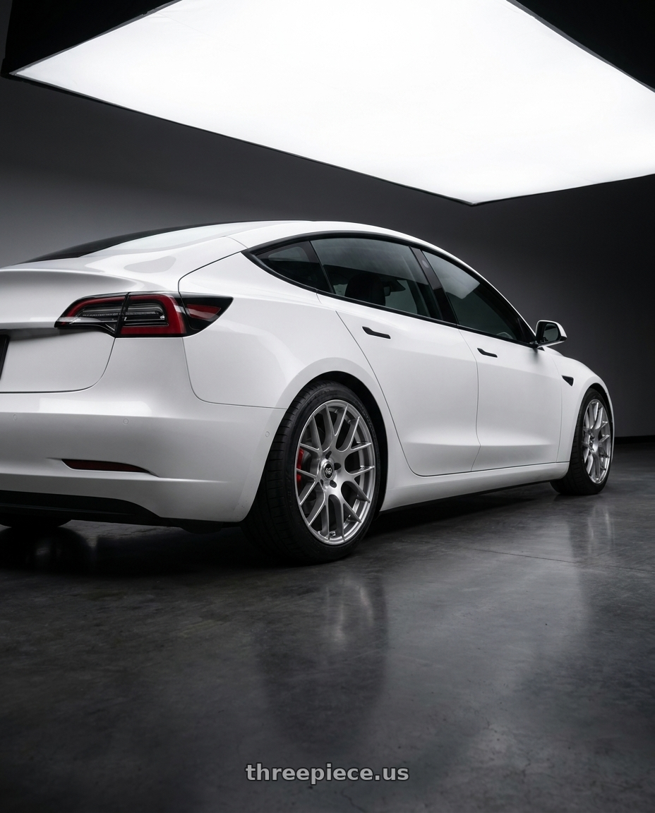 2018 Tesla Model 3 with Enkei Raijin 5x114.3 18x8.5+35 Hyper Silver wheels rear three quarter view square tires