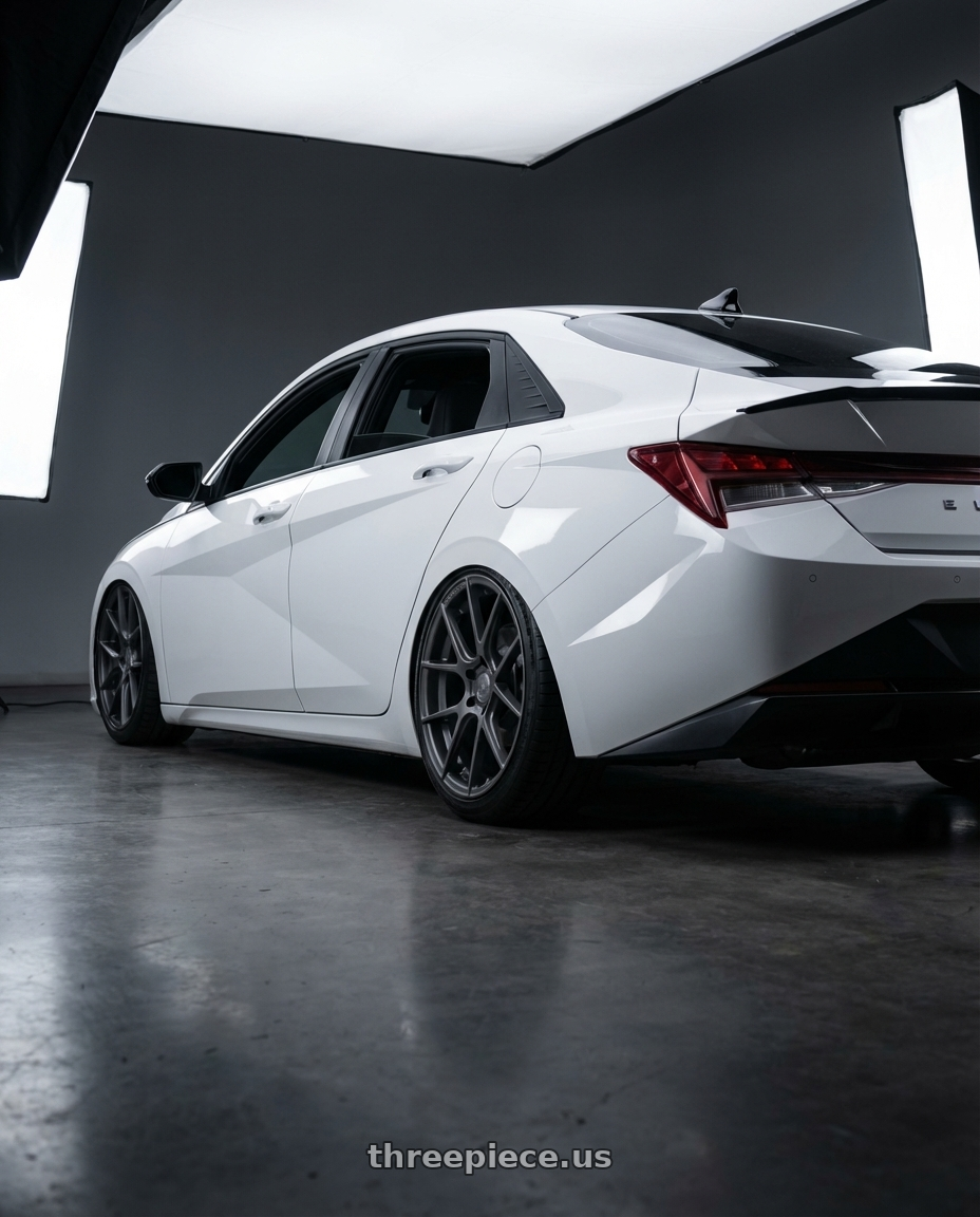 2024 Hyundai Elantra N with Avant Garde Wheels M510 5X114.3 19x9.5 +40 Dolphin Grey wheels rear three quarter view slight stretch tires