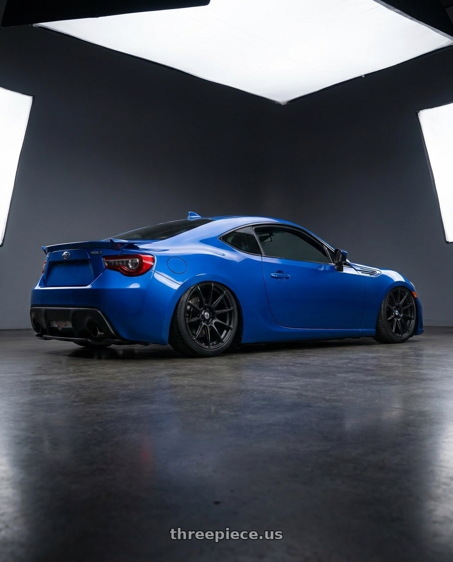 2017 Subaru BRZ with Konig Control 5x100/5x114.3 18x8+45 Matte Black wheels rear three quarter view slight stretch tires