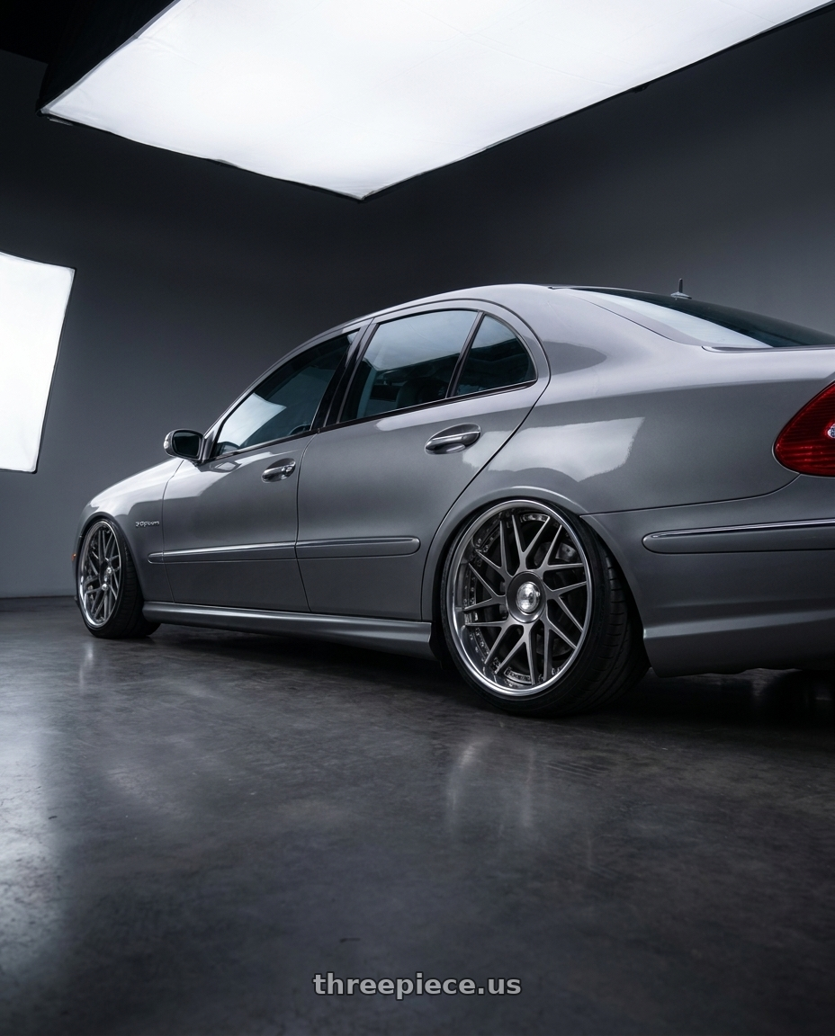 2006 Mercedes E55 AMG with Leon Hardiritt Geist 18x11.0-5 Hi Disk wheels rear three quarter view extreme stretch tires