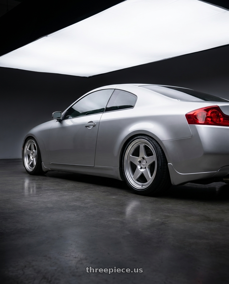 2005 infiniti g35 coupe, silver with Kansei K12H KNP 5x114.3 18x9.5 22 Hyper Silver wheels rear three quarter view slight stretch tires