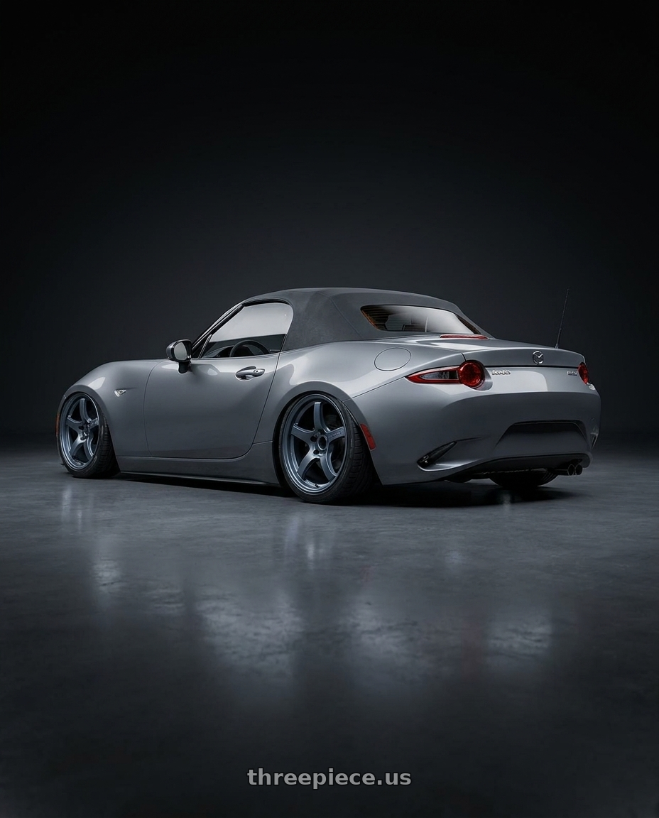 2021 Mazda MX-5 Miata ND with Gram Lights 57CR 5x114.3 17x9+12 Gunblue II wheels rear three quarter view slight stretch tires