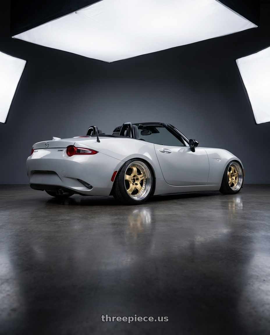 2016 mazda miata with Work Meister S1 3P 4x100 17x8+36 W Disk Bright Buff Finish wheels rear three quarter view slight stretch tires