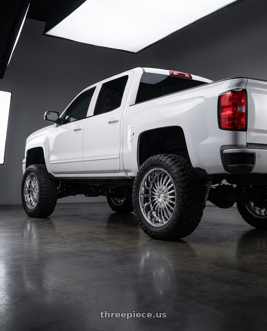 2015 Chevy Silverado with Strada Spina 5x100/5x114.3 20x8 +40 Chrome wheels rear three quarter view meaty tires