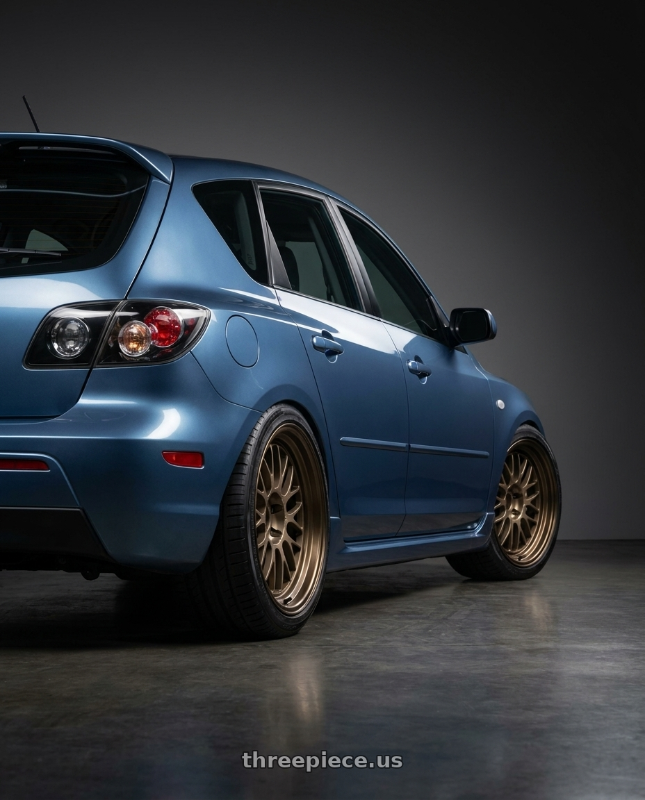 2008 Mazda 3 Aurora Blue with Volk Racing 21A 5x114.3 18X9.5+0  Bronze wheels rear three quarter view square tires