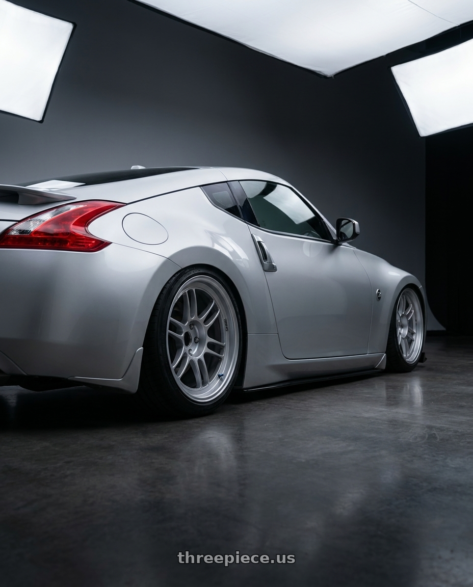 2017 Nissan 370z with Enkei RPF1RS 5x114.3 18x10.5+0 Silver wheels rear three quarter view slight stretch tires