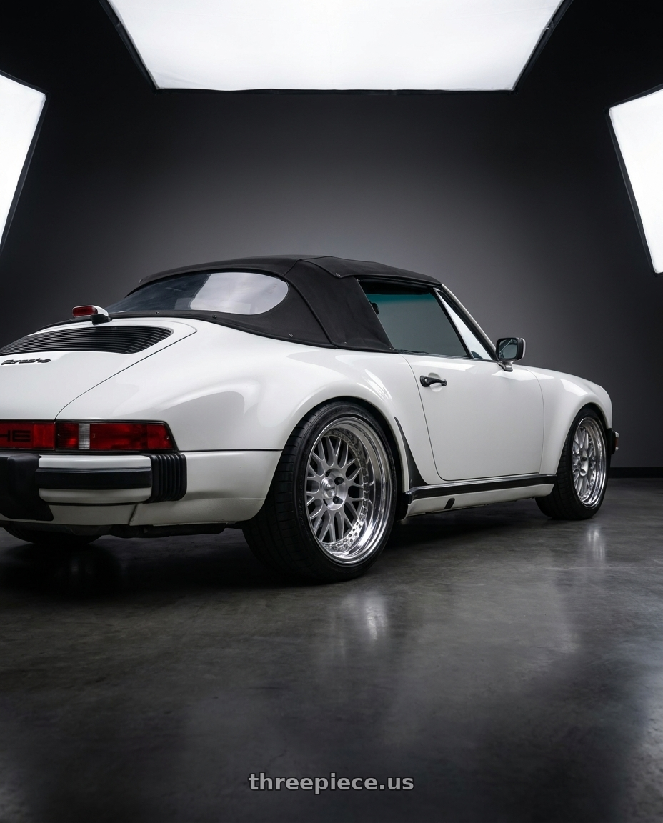 1987 Porsche 930 with Work Meister M1 3p 5x130 18x9-23 H Disk Silver wheels rear three quarter view square tires