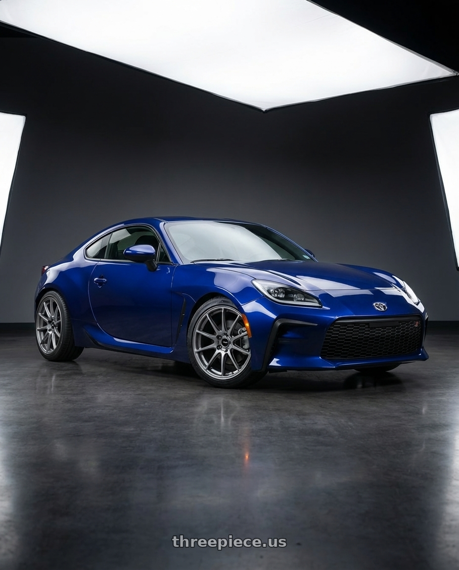 2023 Toyota GR86 base Tureno blue with Enkei Triumph 5x100 18x8.5+45 Storm Gray wheels