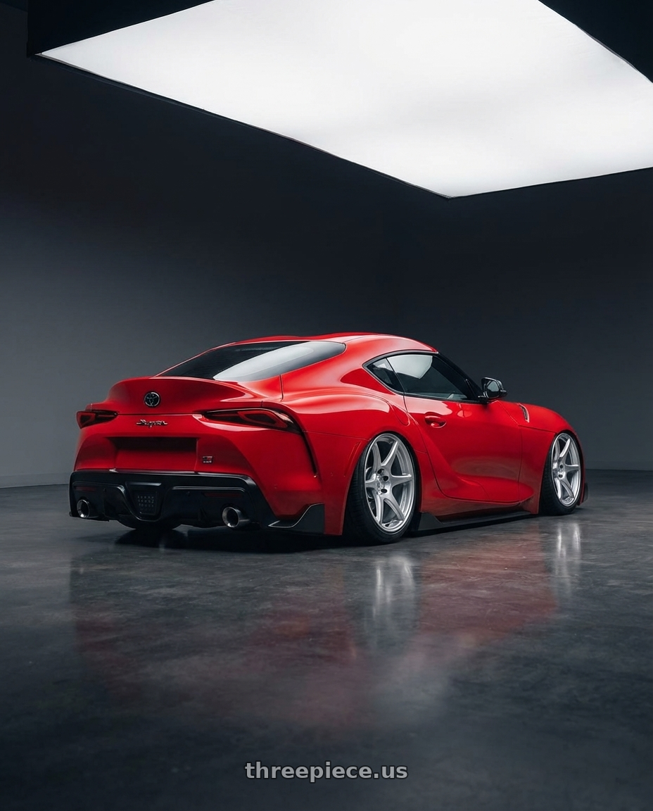 2023 Toyota GR Supra with Kansei K11S Tandem 5X112 19x10.5 22 Hyper Silver wheels rear three quarter view slight stretch tires