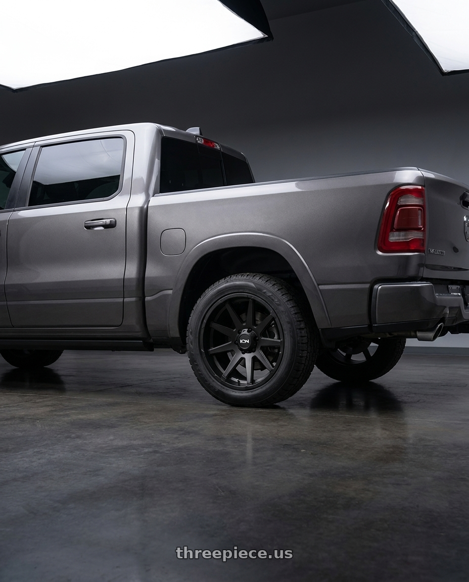 2021 Ram 1500 Laramie with Ion Type 143 6x139.7 20x9+18 Matte Black wheels rear three quarter view square tires
