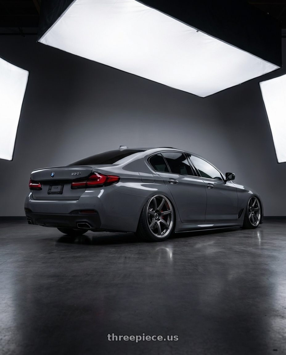 2022 bmw 530i with Work Emotion T7R 2P wheels rear three quarter view slight stretch tires