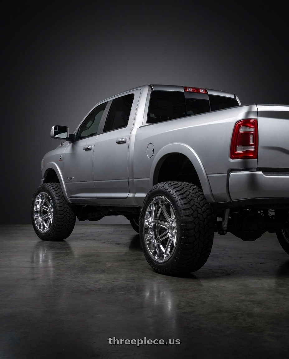 2026 dodge ram 2500 with Axe ARTEMIS 8x165 24X14 -76 CHROME wheels rear three quarter view meaty tires