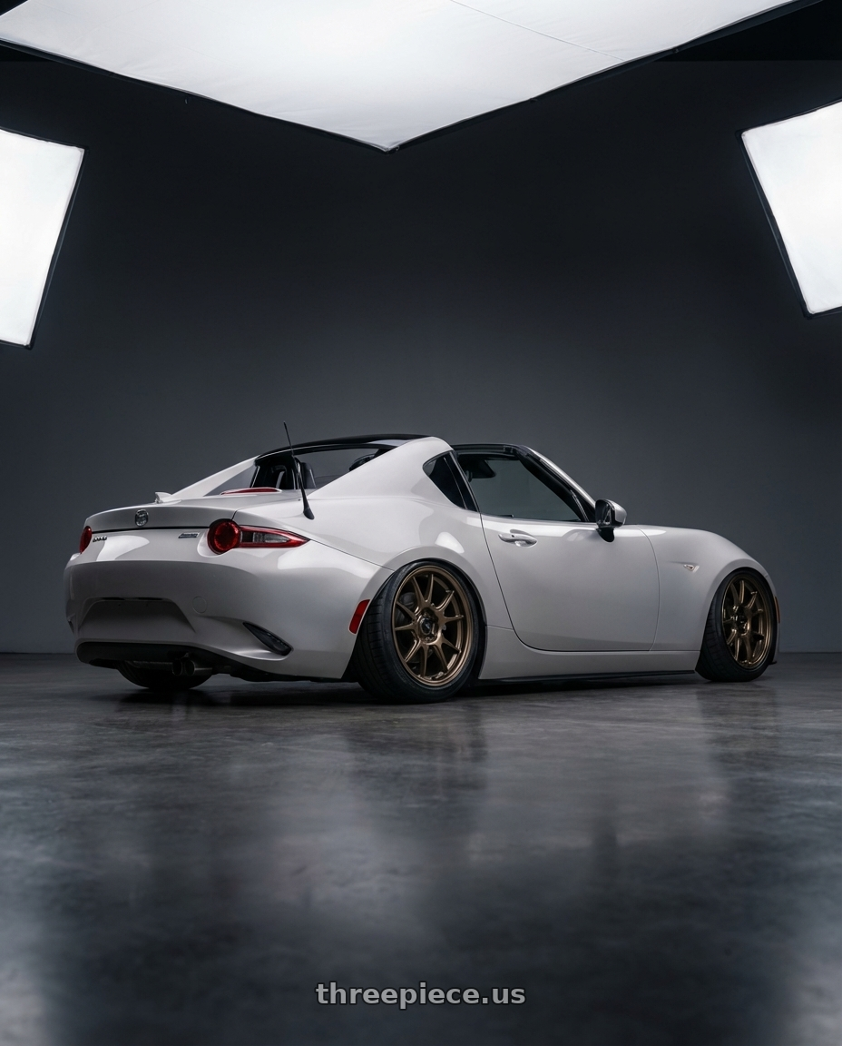 2021 Mazda MX-5 Miata ND with Konig Ampliform 5x114.3 17x9+40 Gloss Bronze wheels rear three quarter view slight stretch tires
