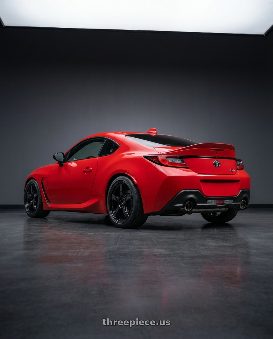 2024 Toyota GR86 with Gram Lights 57CR 5x114.3 18x10.5+12 Glossy Black wheels rear three quarter view square tires