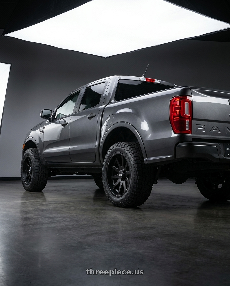 2021 Ford Ranger XL with Ion Type 143 6x139.7 20x10-19 Matte Black wheels rear three quarter view square tires