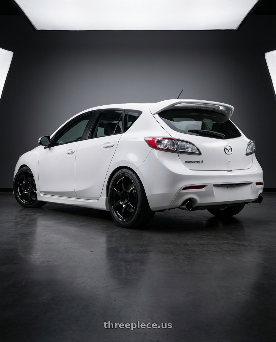 2012 Mazda Mazdaspeed3 with Advan RGIII 5x114.3 18x8.0+37 Gloss Black wheels rear three quarter view square tires