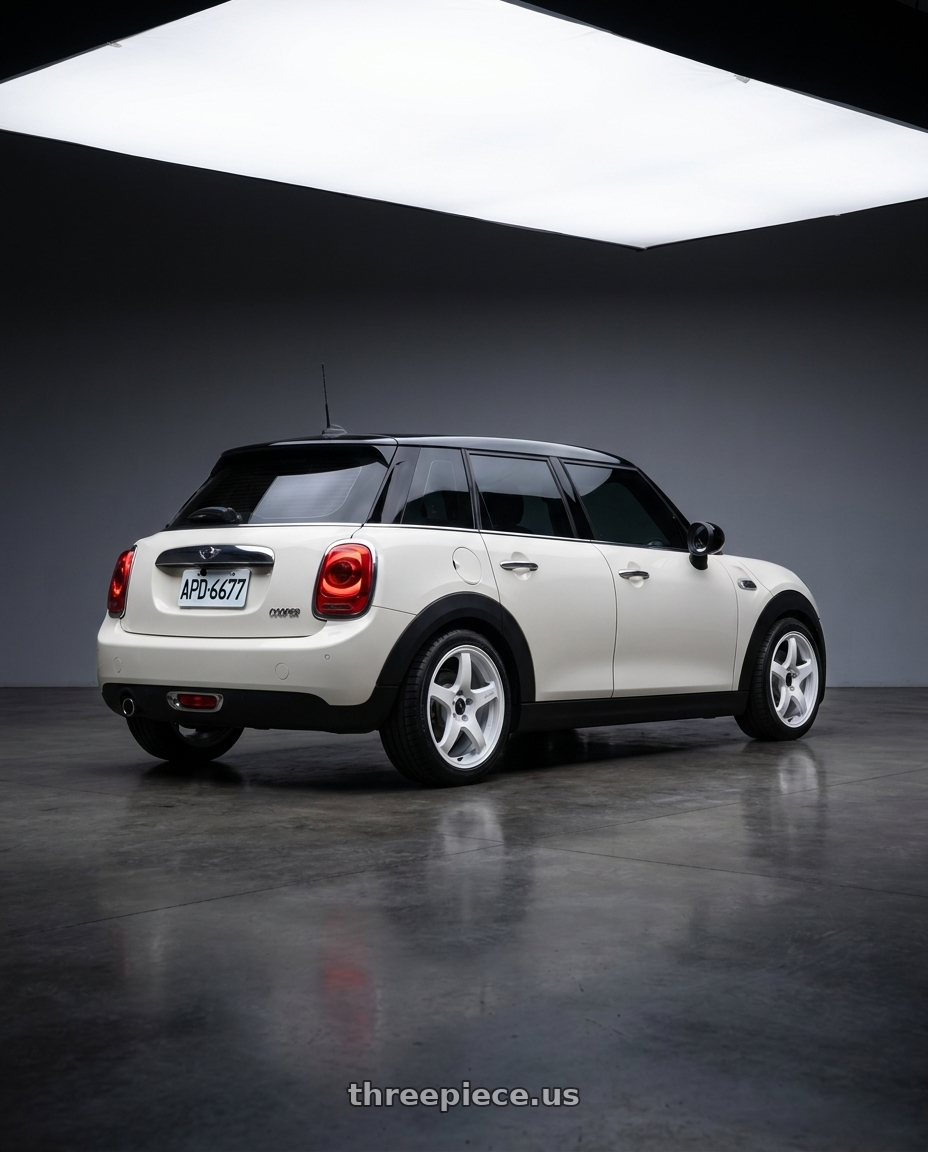 2016 mini cooper 5 door with Enkei PF05 5x100 17x9+40 White Pearl wheels rear three quarter view square tires